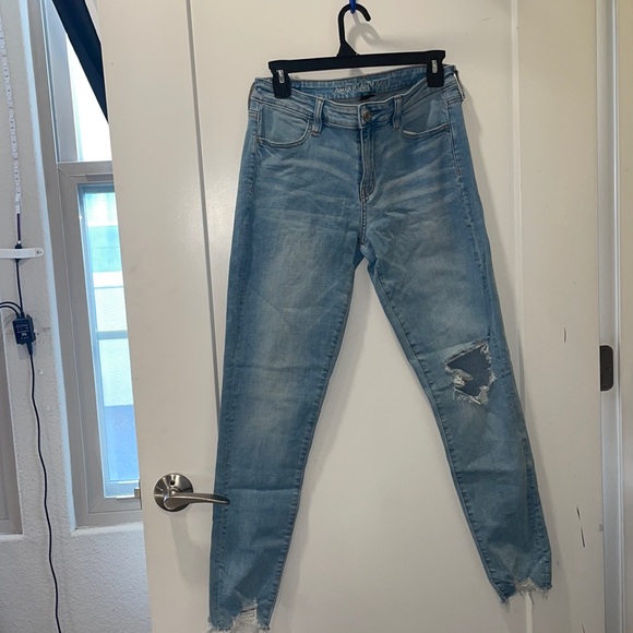 American Eagle Outfitters Denim - American Eagle distressed light denim skinny jeans. Size 10.